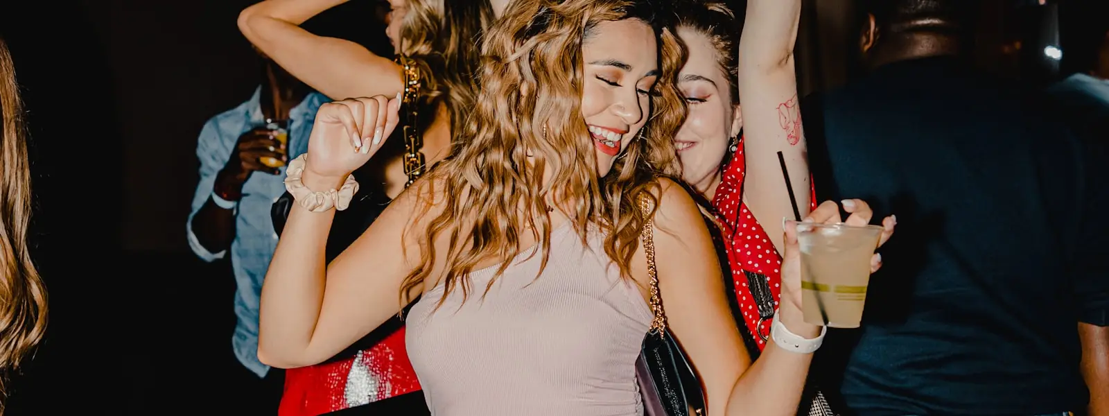 People dancing in a dimly lit club