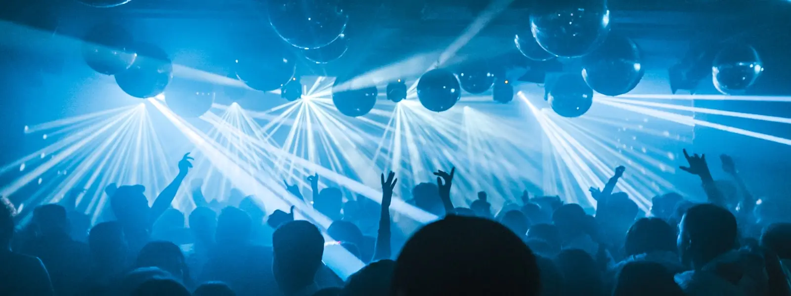 A night crowd watching a stage