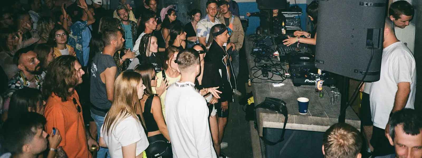 A packed room under stage light